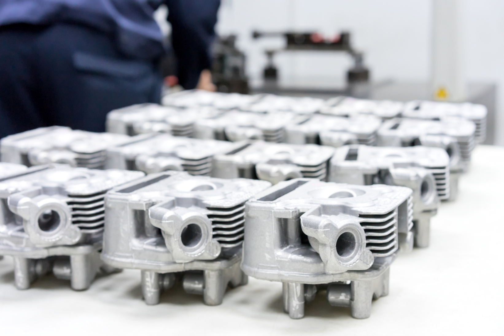 Parts like these aluminum cylinder heads can be 3D-printed in a fraction of the time it would take to machine or cast them.